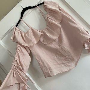 pink top with flow arms and off the shoulder